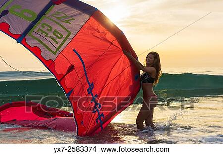 Woman with a kitesurf at the beach. Tarifa, Costa de la Luz, Cadiz, Andalusia, Southern Spain. View Large Photo Image Picture - Woman with a kitesurf at the beach. Tarifa, Costa de la Luz, Cadiz, Andalusia, Southern Spain.. Fotosearch
