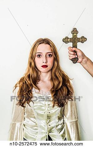 Woman's hand holding a cross next to a blonde teenage girl. View Large Photo Image Stock Photography - Woman's hand holding a cross next to a blonde teenage girl.. Fotosearch