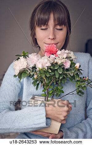 Stock Image - women with flowers.. Fotosearch