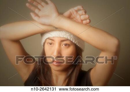 Young Asian woman wearing a hat. View Large Photo Image Stock Image - Young Asian woman wearing a hat.. Fotosearch