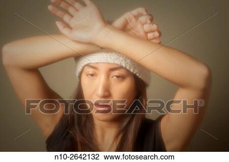 Young Asian woman wearing a hat. View Large Photo Image Stock Image - Young Asian woman wearing a hat.. Fotosearch