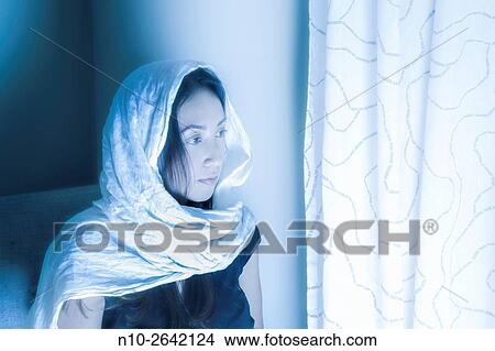 Picture - Young Asian woman wearing a head wrop.. Fotosearch