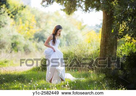 Stock Photo - Young bride runaway. Fotosearch