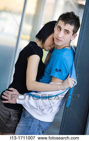 Stock Photo - Young couple embracing. Fotosearch