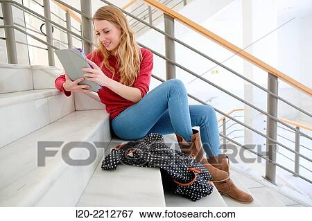 Young female student with digital tablet at campus View Large Photo Image Stock Photo - Young female student with digital tablet at campus. Fotosearch