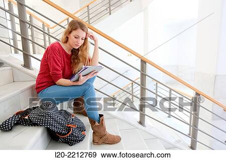 Young female student with digital tablet at campus View Large Photo Image Stock Photo - Young female student with digital tablet at campus. Fotosearch