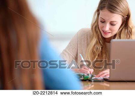 Young female student with laptop at campus View Large Photo Image Picture - Young female student with laptop at campus. Fotosearch