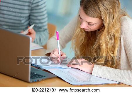 Young female student with laptop at campus View Large Photo Image Stock Photo - Young female student with laptop at campus. Fotosearch
