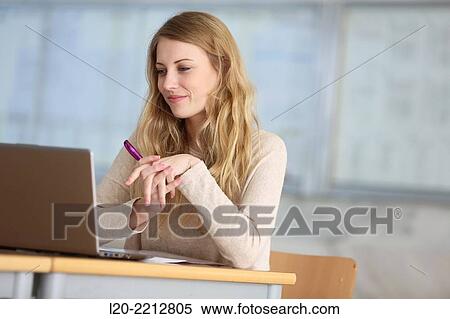 Young female student with laptop at campus View Large Photo Image Stock Photography - Young female student with laptop at campus. Fotosearch