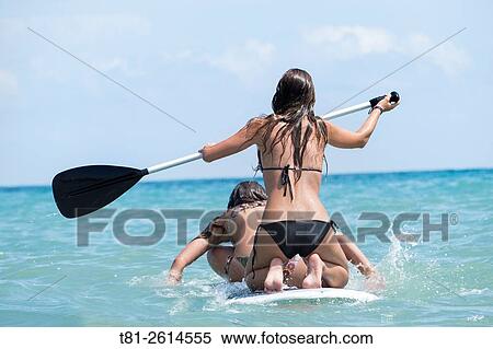 Young girls on paddleboard, Peiscola, Spain View Large Photo Image Stock Photography - Young girls on paddleboard, Peiscola, Spain. Fotosearch