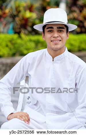 Young hispanic man in formal clothes, wearing white shirt, pants and hat, smiling at camera. View Large Photo Image Stock Photograph - Young hispanic man in formal clothes, wearing white shirt, pants and hat, smiling at camera.. Fotosearch