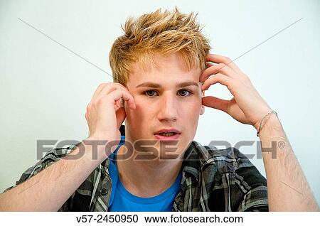 Stock Image - Young man feeling worried.. Fotosearch