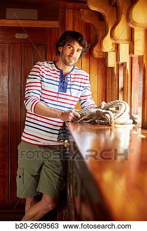 Young man in a sailboat, galleon. Basque Country. Spain View Large Photo Image Stock Image - Young man in a sailboat, galleon. Basque Country. Spain. Fotosearch