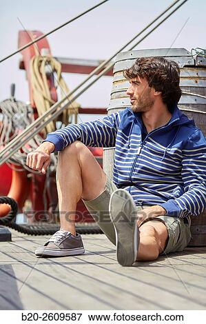 Young man in a sailboat, galleon. Basque Country. Spain View Large Photo Image Stock Photo - Young man in a sailboat, galleon. Basque Country. Spain. Fotosearch