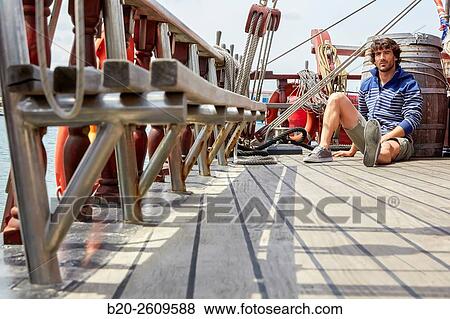 Young man in a sailboat, galleon. Basque Country. Spain View Large Photo Image Stock Photo - Young man in a sailboat, galleon. Basque Country. Spain. Fotosearch