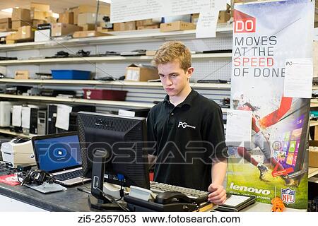 Young man in training in computer repair shop View Large Photo Image Stock Image - Young man in training in computer repair shop. Fotosearch