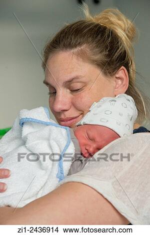 young mother with new born child in hospital View Large Photo Image Picture - young mother with new born child in hospital. Fotosearch