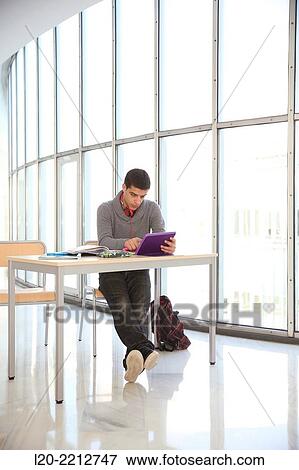 Young student with digital tablet at campus View Large Photo Image Stock Photo - Young student with digital tablet at campus. Fotosearch