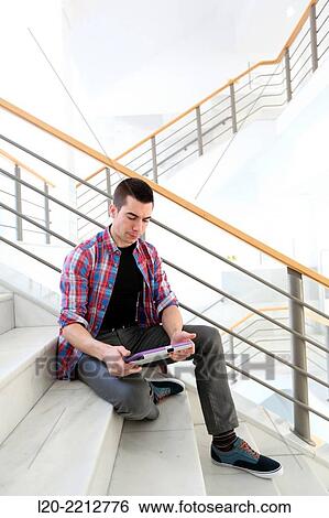 Young student with digital tablet at campus View Large Photo Image Stock Photograph - Young student with digital tablet at campus. Fotosearch
