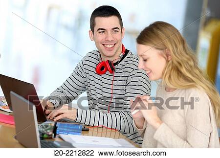 Young students with laptop at campus View Large Photo Image Stock Image - Young students with laptop at campus. Fotosearch