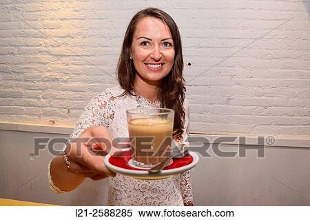 Young waitress serving a ´cortado´. Barcelona, Catalonia, Spain. View Large Photo Image Stock Photography - Young waitress serving a ´cortado´. Barcelona, Catalonia, Spain.. Fotosearch