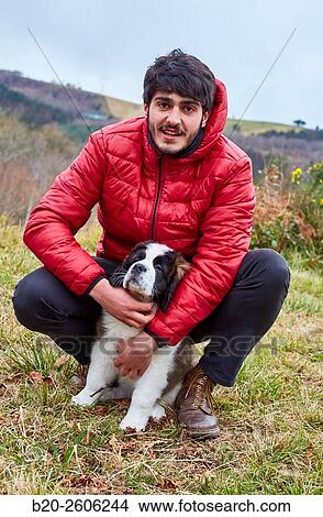 Young with Saint Bernard dog. Gipuzkoa. Basque Country. Spain View Large Photo Image Picture - Young with Saint Bernard dog. Gipuzkoa. Basque Country. Spain. Fotosearch