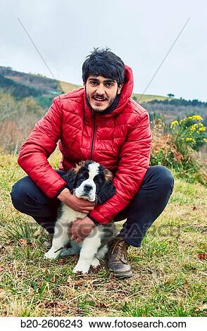 Young with Saint Bernard dog. Gipuzkoa. Basque Country. Spain View Large Photo Image Stock Image - Young with Saint Bernard dog. Gipuzkoa. Basque Country. Spain. Fotosearch
