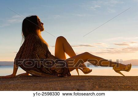 Young woman and sunset almost silhouette View Large Photo Image Stock Image - Young woman and sunset almost silhouette. Fotosearch