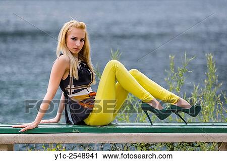 Young woman fanciful on park bench. View Large Photo Image Stock Image - Young woman fanciful on park bench.. Fotosearch