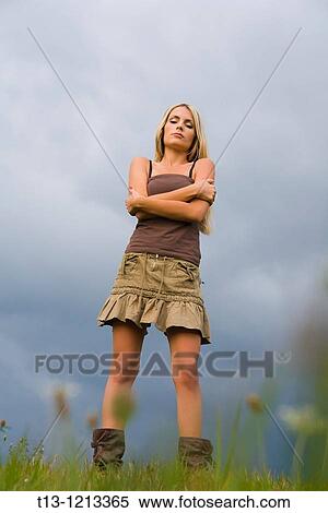 Stock Photography - Young woman feels coldness. Fotosearch