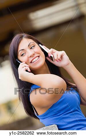 Stock Image - Young woman frantic work. Fotosearch
