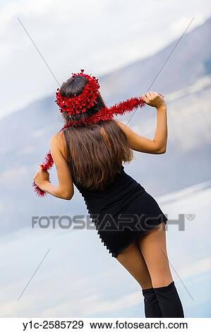 Young woman from back with celebration Red stripe View Large Photo Image Stock Photo - Young woman from back with celebration Red stripe. Fotosearch