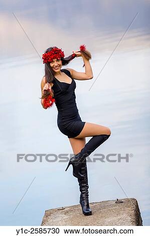 Stock Image - Young woman happy with celebration Red stripe. Fotosearch