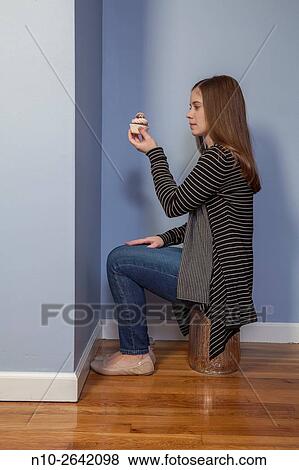Young woman holding a cupcake. View Large Photo Image Stock Photo - Young woman holding a cupcake.. Fotosearch