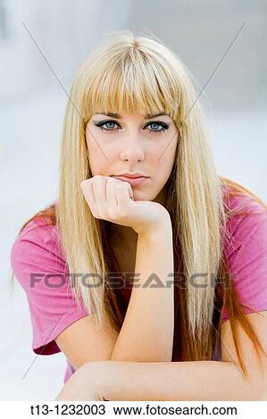 Young woman in a bad mood View Large Photo Image Stock Image - Young woman in a bad mood. Fotosearch