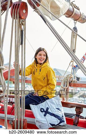 Stock Image - Young woman in a sailboat, galleon. Basque Country. Spain. Fotosearch