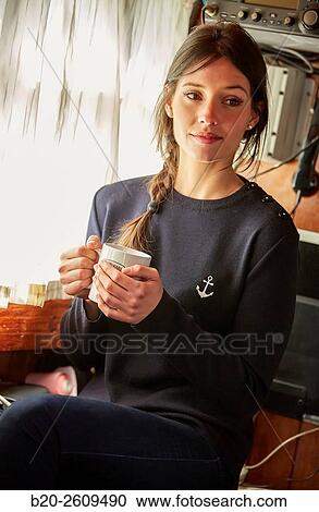 Stock Image - Young woman in a sailboat, galleon. Basque Country. Spain. Fotosearch