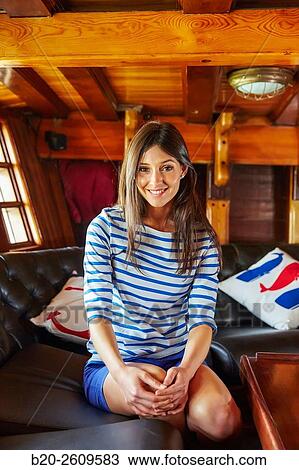 Stock Image - Young woman in a sailboat, galleon. Basque Country. Spain. Fotosearch
