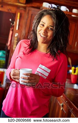 Stock Photograph - Young woman in the kitchen of a sailboat, galleon. Basque Country. Spain. Fotosearch