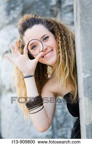 Young woman looking through the ring View Large Photo Image Stock Image - Young woman looking through the ring. Fotosearch