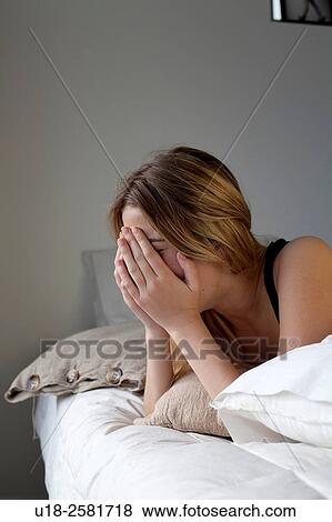 Young woman on bed View Large Photo Image Stock Photo - Young woman on bed. Fotosearch