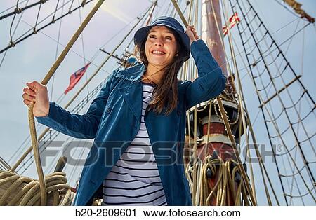 Young woman on the outside of a sailboat, galleon. Masts. Basque Country. Spain View Large Photo Image Stock Image - Young woman on the outside of a sailboat, galleon. Masts. Basque Country. Spain. Fotosearch