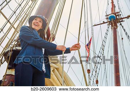 Young woman on the outside of a sailboat, galleon. Masts. Basque Country. Spain View Large Photo Image Stock Image - Young woman on the outside of a sailboat, galleon. Masts. Basque Country. Spain. Fotosearch