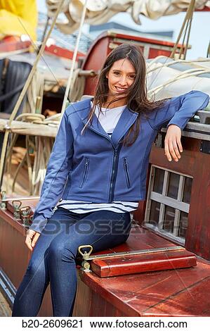 Young woman on the outside of a sailboat, galleon. Basque Country. Spain View Large Photo Image Stock Image - Young woman on the outside of a sailboat, galleon. Basque Country. Spain. Fotosearch