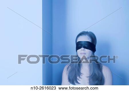 Young woman wearing a black blindfold. View Large Photo Image Stock Image - Young woman wearing a black blindfold.. Fotosearch