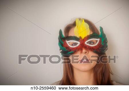 Young woman wearing a mask. View Large Photo Image Stock Image - Young woman wearing a mask.. Fotosearch