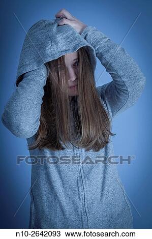 Young woman wearing a sweatshirt and hoodie. View Large Photo Image Stock Image - Young woman wearing a sweatshirt and hoodie.. Fotosearch