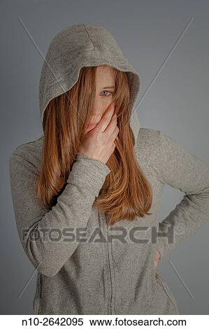 Young woman wearing a sweatshirt and hoodie. View Large Photo Image Stock Photography - Young woman wearing a sweatshirt and hoodie.. Fotosearch
