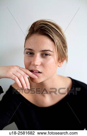 young woman wearing something black View Large Photo Image Stock Image - young woman wearing something black. Fotosearch