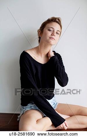 Stock Image - young woman wearing something black. Fotosearch
